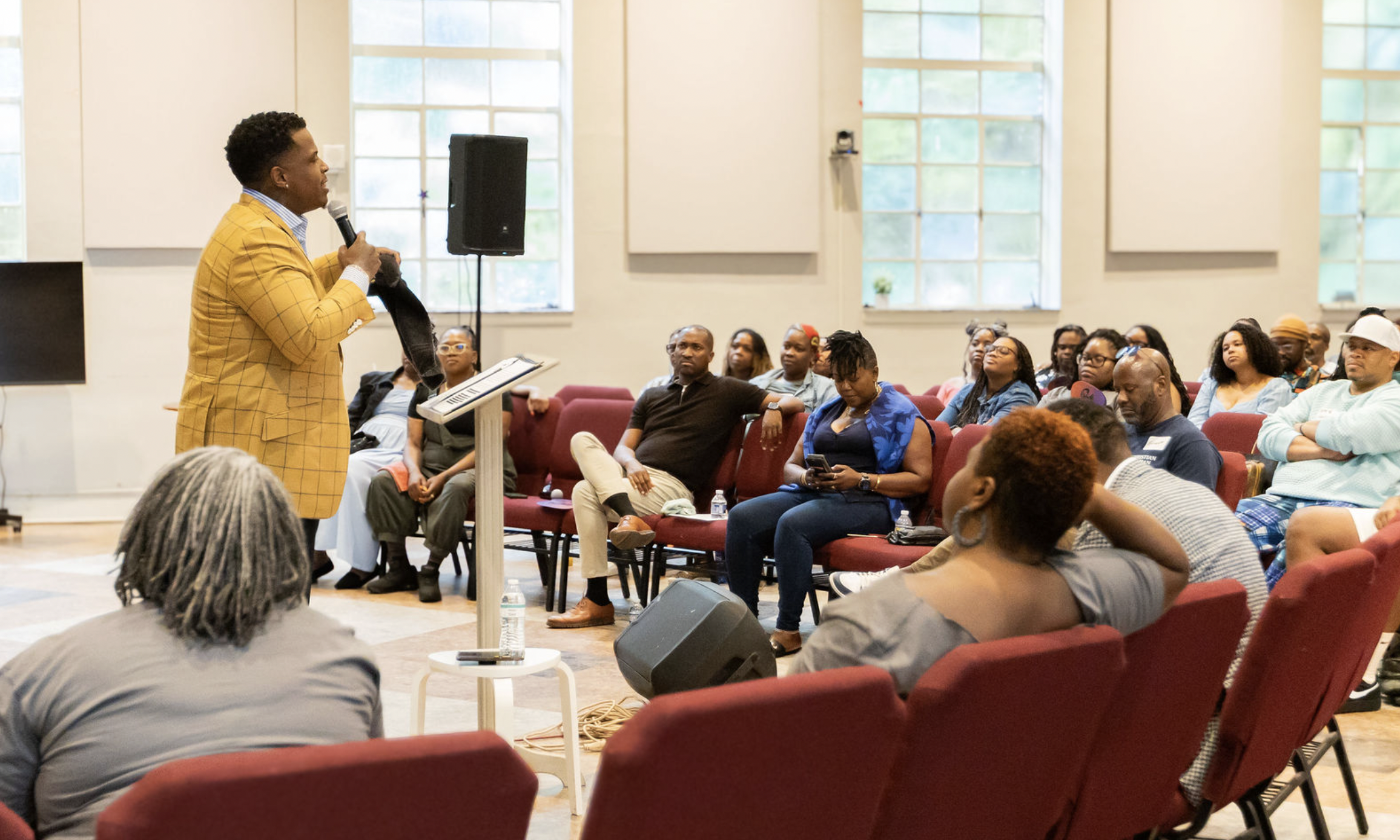 Kristian A. Smith teaching a seated audience